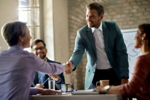 business coworkers shaking hands during meeting office focus is businessman 300x200 - أكفأ 4 طرق للتسويق بالعمولة