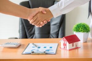 hands agent client shaking hands after signed contract buy new apartment 300x200 - الاستثمار العقاري في الإمارات