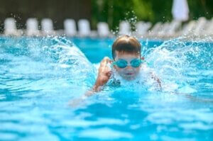 boy goggles swimming splashing pool 300x199 - الأطقم الرياضية للأطفال