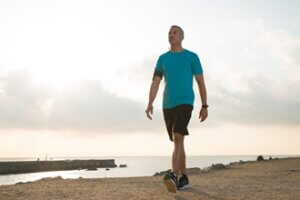 confident male jogger walking after running 300x200 - ما هي الرياضات التي يمكن ممارستها بانتظام