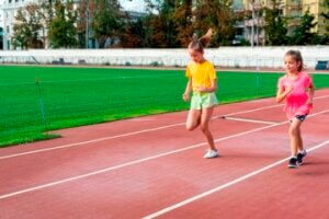 front view girls running track 300x200 - الأطقم الرياضية للأطفال