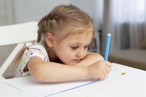 high angle young girl drawing 300x200 - 5 طرق لمساعدة الطفل الخجول